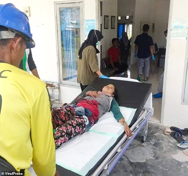 Woman is dragged into a swamp by a crocodile and somehow survives in its jaws for 90 MINUTES before being hauled to safety in Indonesia Woman is dragged into a swamp by a crocodile and somehow survives in its jaws for 90 MINUTES before being hauled to safety in Indonesia