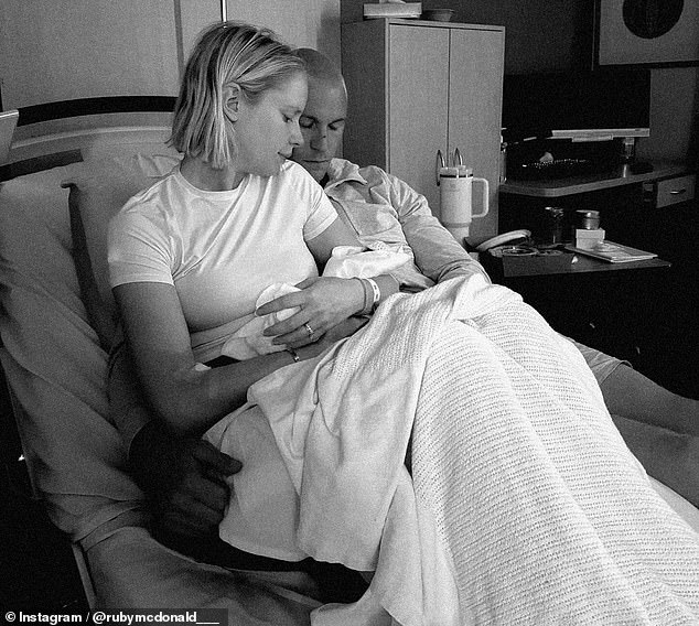 Footy star Tom McDonald and his wife share heartbreaking photo and tribute after their baby daughter was stillborn Melbourne Demons veteran Tom McDonald and his wife Ruby are shattered after their baby daughter Goldie (pictured together) was stillborn