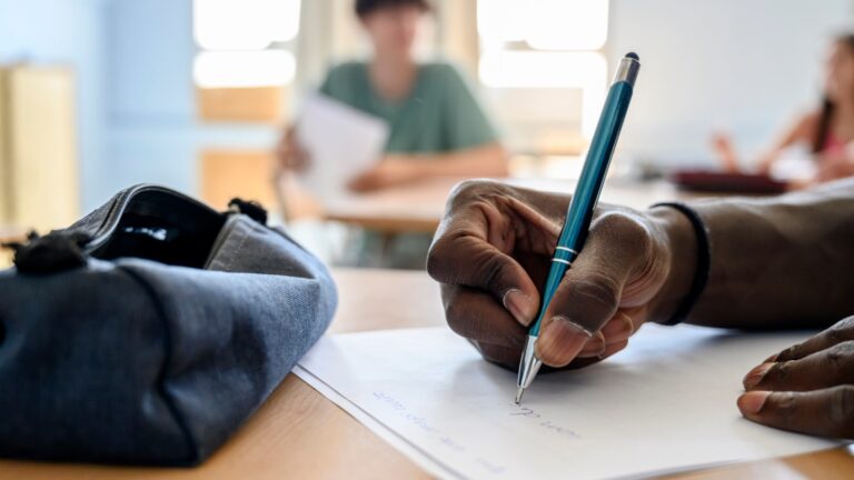 Handwriting may boost brain connections that aid memory a close up of a hand with a pen writing