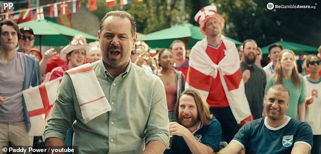 Danny Dyer serves pints before stripping down to his swimming trunks as he joins Peter Crouch in hysterical Paddy Power ad as Euros 2024 fever kicks off Danny Dyer, 46, (L) was back serving pints almost two years after quitting the role of Queen Vic landlord Mick Carter in EastEnders (Pictured with Peter Crouch, right)