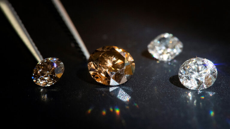 New lab trick makes diamonds without extreme pressure Four diamonds of varying hues are shown on a black background