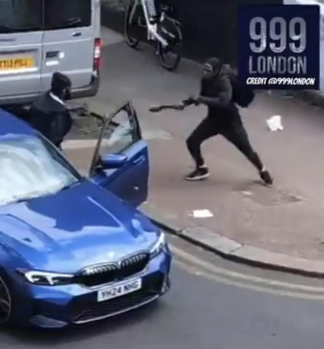 Shocking moment thugs armed with Rambo knives fight in the middle of the day on residential London street Two men, both dressed in all-black clothes, were seen hacking Rambo knives at each other at around 1:50pm on Monday on Cadoxton Avenue in Tottenham