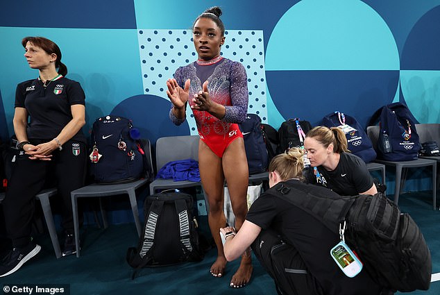 Simone Biles endures brutal day at the Olympics as she injures herself before taking silver on the floor following huge error on the beam Simone Biles endures brutal day at the Olympics as she injures herself before taking silver on the floor following huge error on the beam