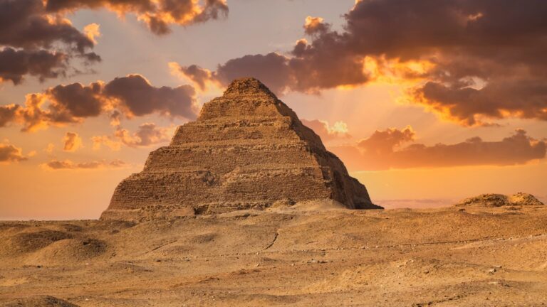 Did builders of Egypt’s first pyramid use a water-powered elevator? Egyptian King Djoser's pyramid rises above a sandy landscape, while sun-tinged clouds cast a golden glow on the scene.