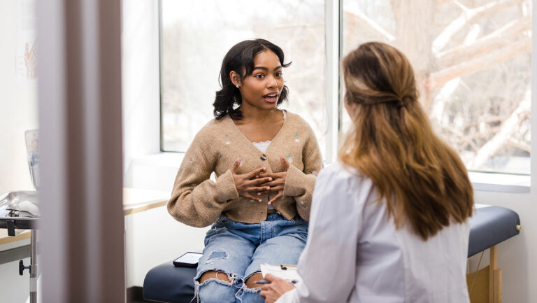 Use of injectable GLP-1 weight-loss drugs skyrockets among teens a teen girl speaking with a doctor in a clinic