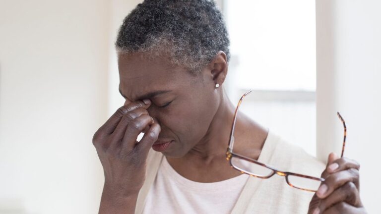Ways To Protect Your Eye Health Daily a woman rubs her eyes