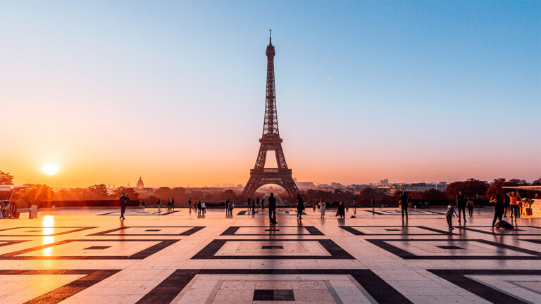 How people suppress memories may be key to PTSD recovery An orange sun reflects light on the smooth plaza in front of the Eiffel Tower in Paris.