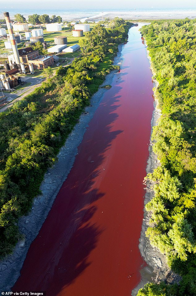 Biblical omen sparks panic as gushing Argentine river turns blood red An aerial view shows the blood-red Sarandí Canal on the outskirts of Buenos Aires
