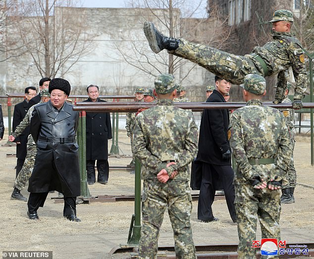 North Korea ‘disappears’ 20 of its elite soldiers with death notices sent to their loved ones after they ‘endangered Kim Jong-un’s life’ by breaking one simple rule File photo. North Korean leader Kim Jong Un watches a cadet practicing at the Kang Kon Military Academy, in Pyongyang, North Korea, February 25, 2025