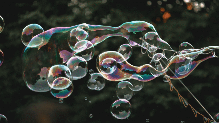 Experiment: Blow the best homemade bubbles bubbles drift through the wind with trees in the background