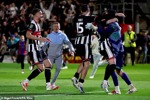 Grimsby 2-2 Man United (Grimsby win 12-11 on pens): Where do Ruben Amorim’s dismal side go from here after humiliating Carabao Cup exit? Grimsby celebrate after securing a famous win against Man United on penalties