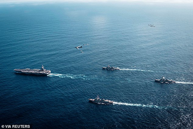 World waits to see if Trump will attack Venezuela: President’s top military adviser heads to region where US has gathered huge fleet of warships as pressure on Maduro to quit grows The US Navy's Gerald R. Ford Carrier Strike Group, and supporting vessels sailing towards the Caribbean last week. The Ford is the largest aircraft carrier in the world