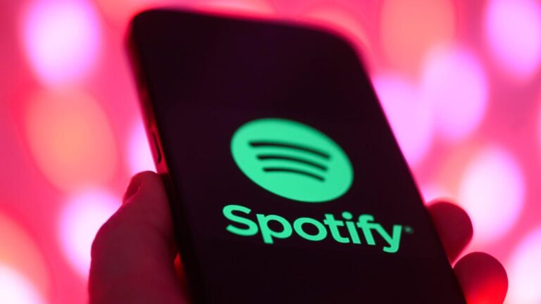 Spotify Adds New Social Listening Features on Mobile. Here’s How to Use Them Spotify logo on mobile phone